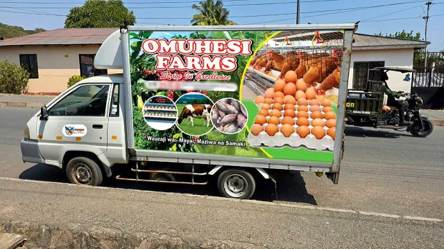 The OMUHESI FARMS branded delivery truck