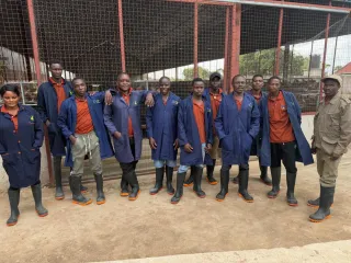 The OMUHESI FARMS team in uniform at the layer house