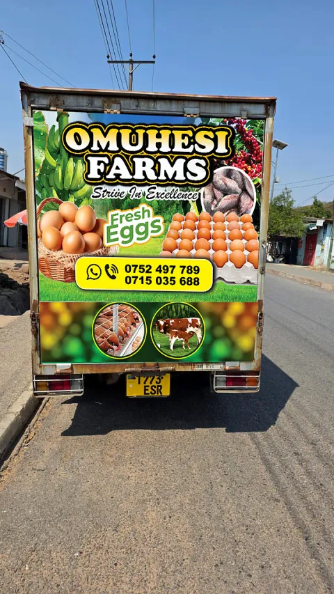 Rear of the OMUHESI FARMS truck with fresh egg branding